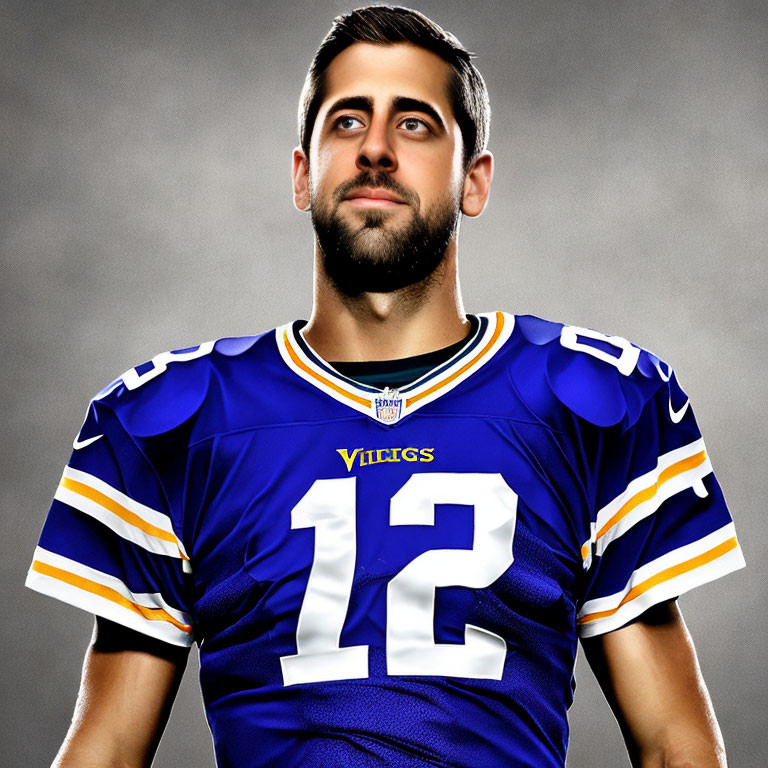 Bearded man in Vikings jersey, number 12, against gray backdrop