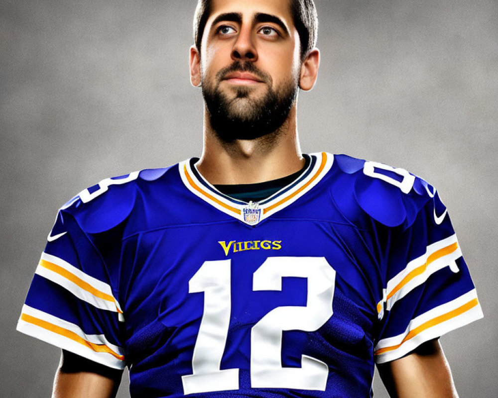 Bearded man in Vikings jersey, number 12, against gray backdrop