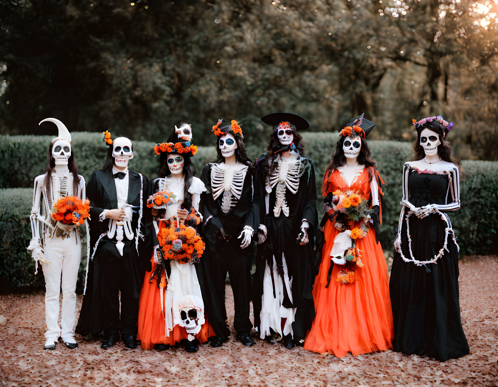 Elaborate Day of the Dead costumes and makeup in outdoor setting