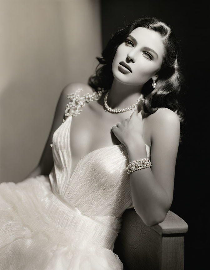 Monochrome image of woman in Hollywood glamour with jewelry