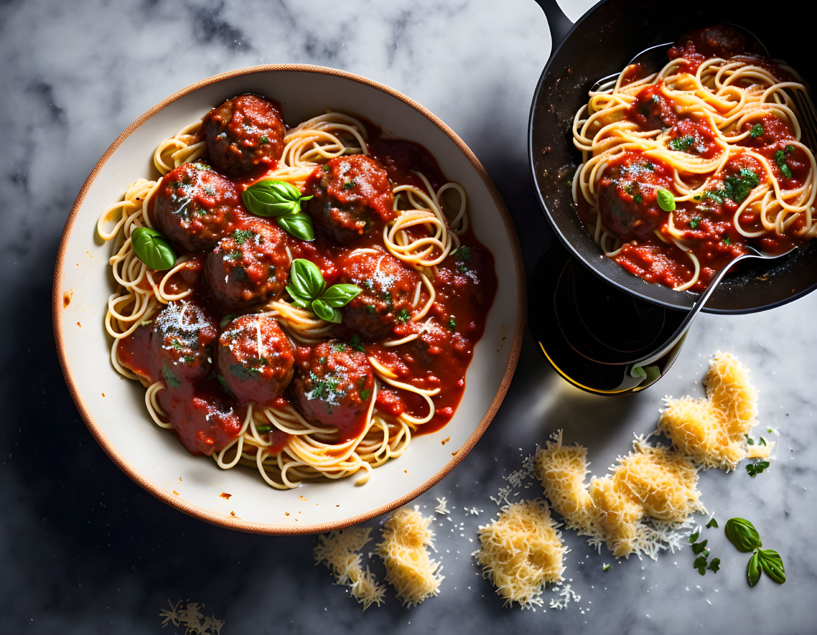 Spaghetti and Meatballs with Marinara Sauce, Basil Leaf, Cheese, and Fork