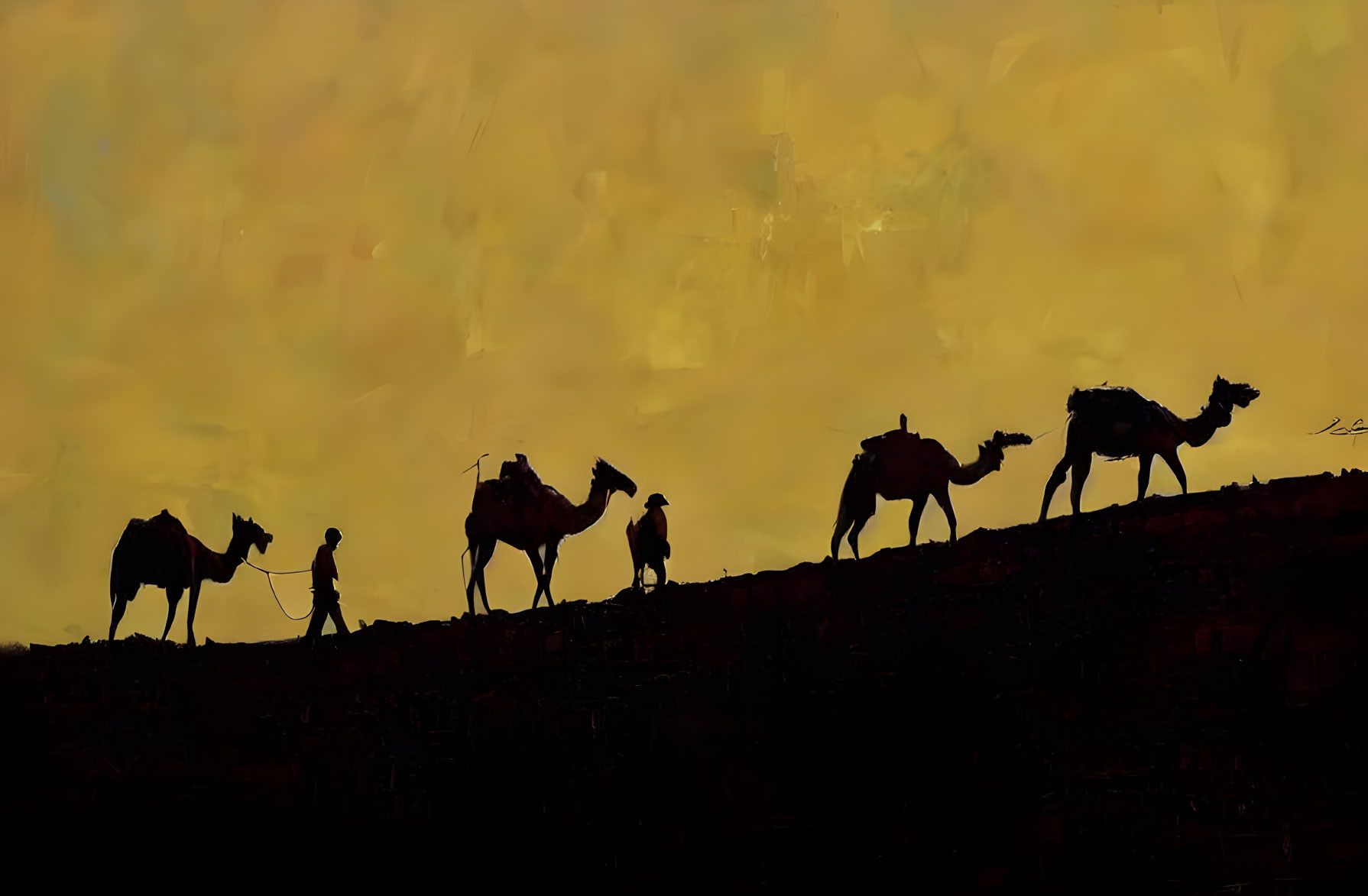 Silhouette of camel caravan and individuals at sunset