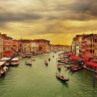 Impressionist-style painting of colorful Venice canal at sunset