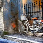 Vintage Bicycle Against Floral Garden and Iron Gate with Sunlight Filtering Through Blossoming Trees