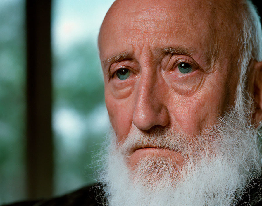 Elderly Man with White Beard and Solemn Expression Portrait