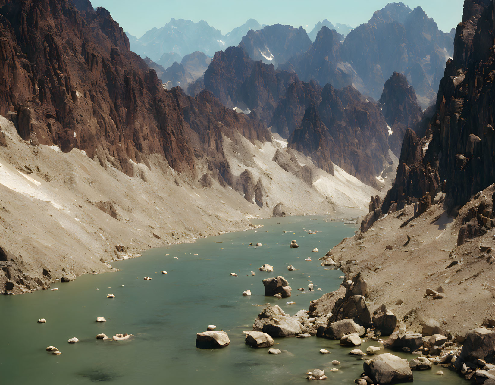 Serene river in rugged mountain landscape with steep cliffs