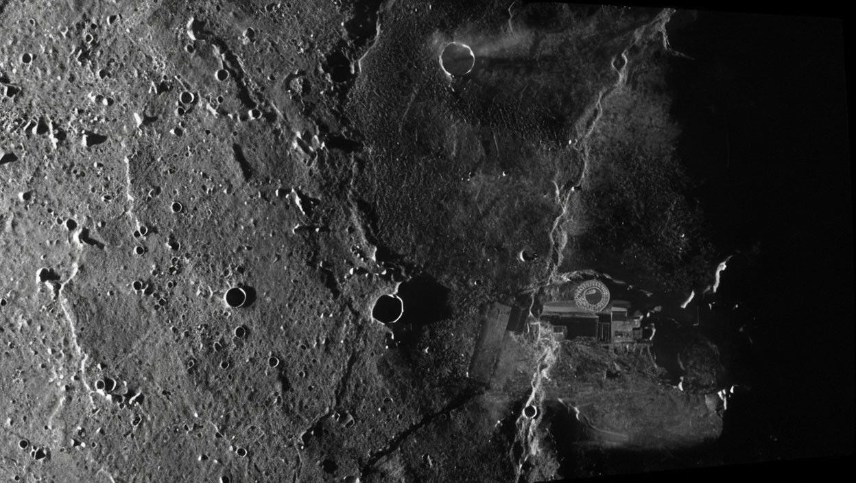 Moon surface with craters, lander, footprints, Earth in background