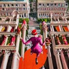 Woman in red hat walking tightrope between colorful buildings