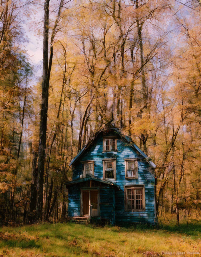 Weathered Blue House Surrounded by Autumn Trees