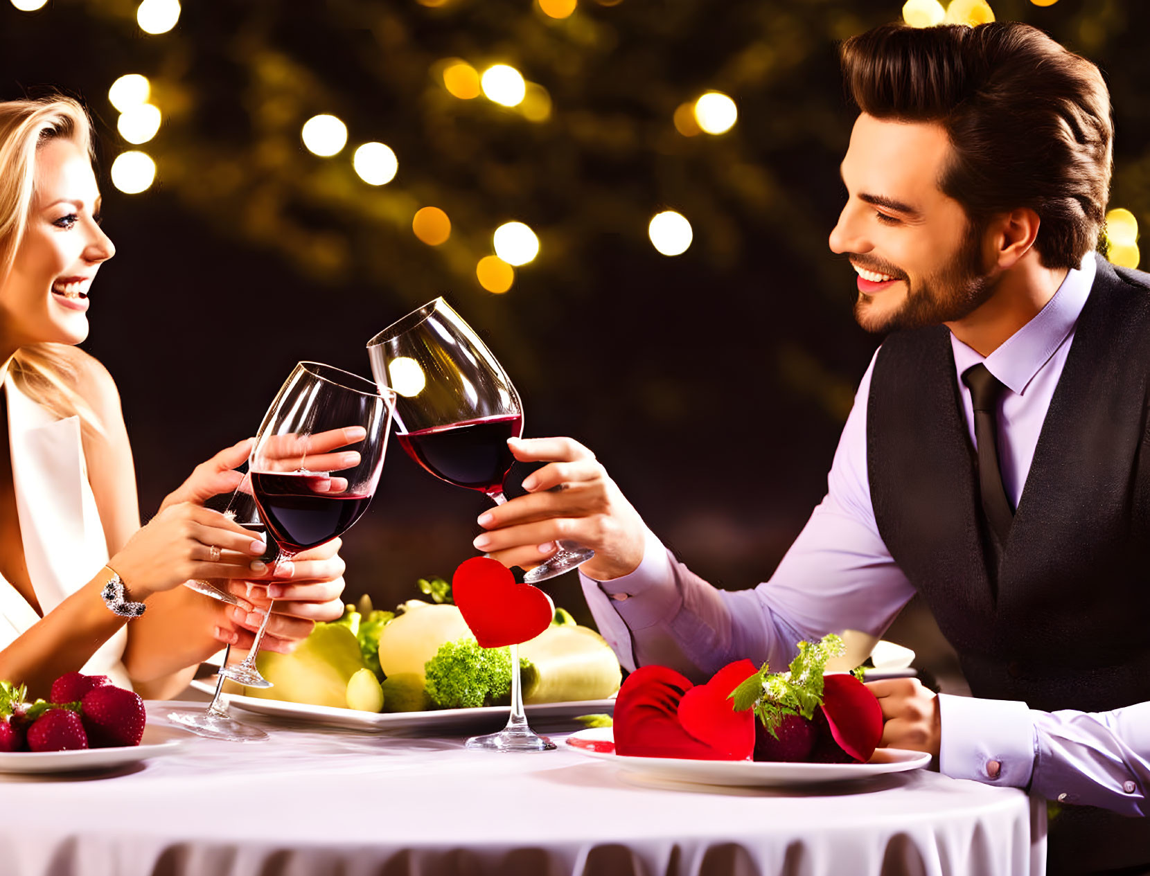 Romantic Couple Toasting with Red Wine at Elegant Dinner Table