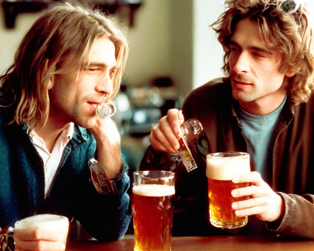 Two Men Pouring Drinks and Holding Beer Glasses at Bar