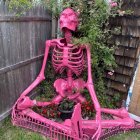 Colorful Flower-covered Skeleton by Quaint Building Facade