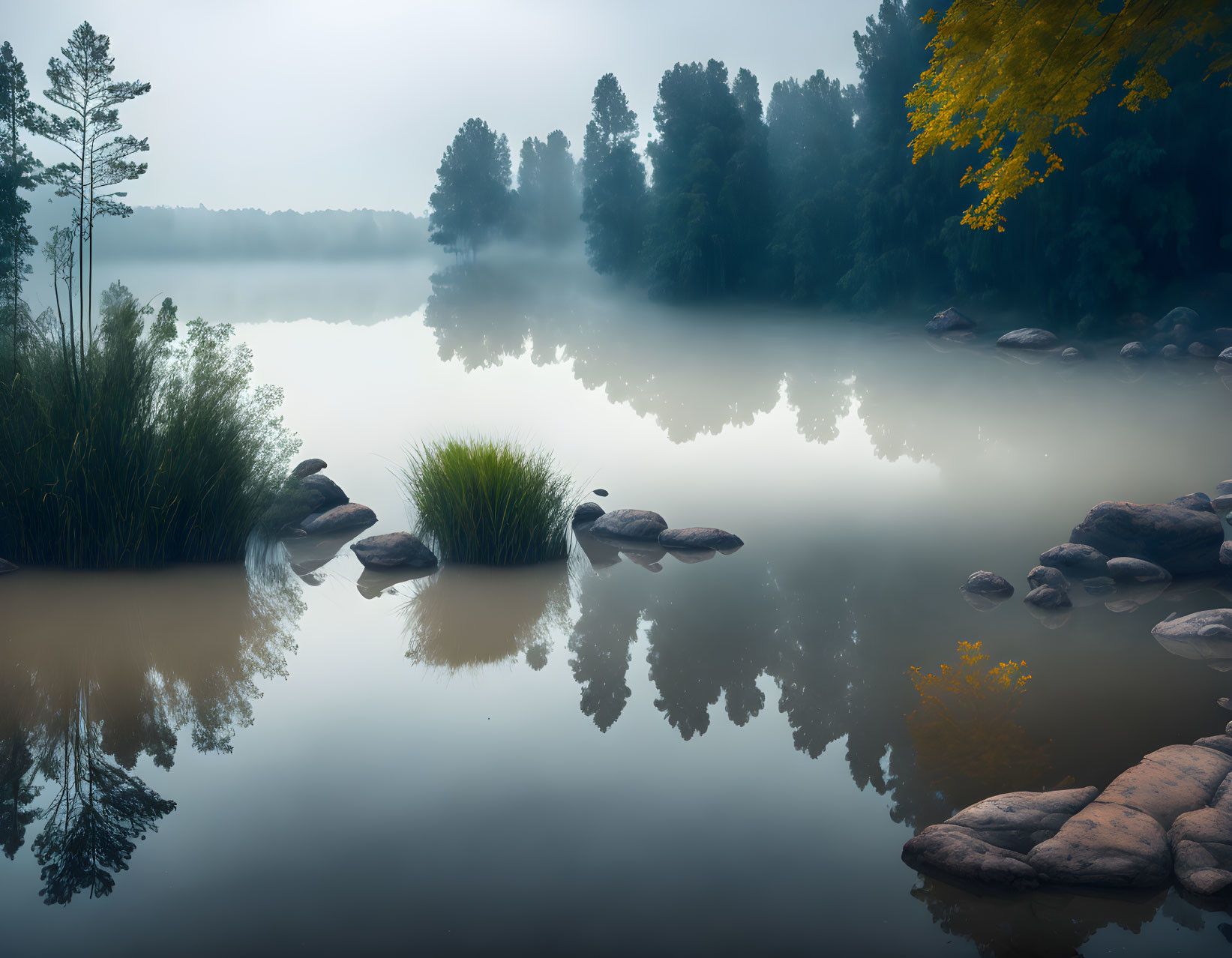 Tranquil Misty Lake with Autumn Foliage Reflections