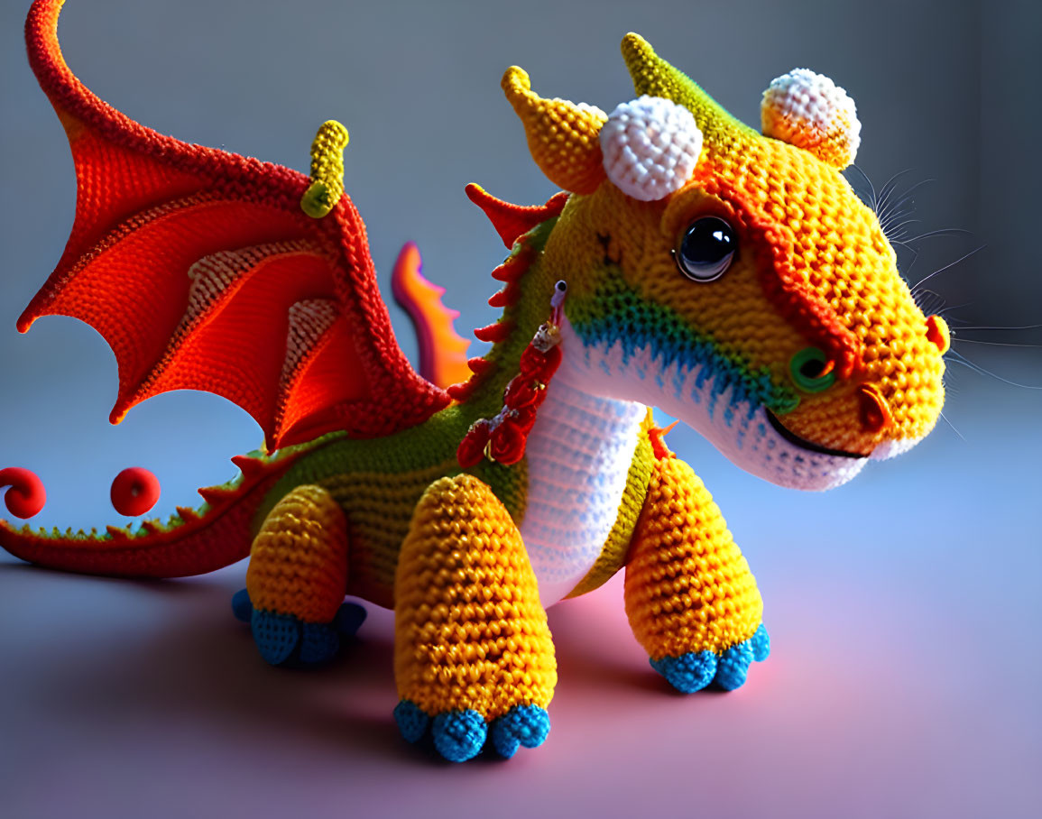 Colorful Crocheted Dragon Toy with Orange, Yellow, Red, and Blue Details