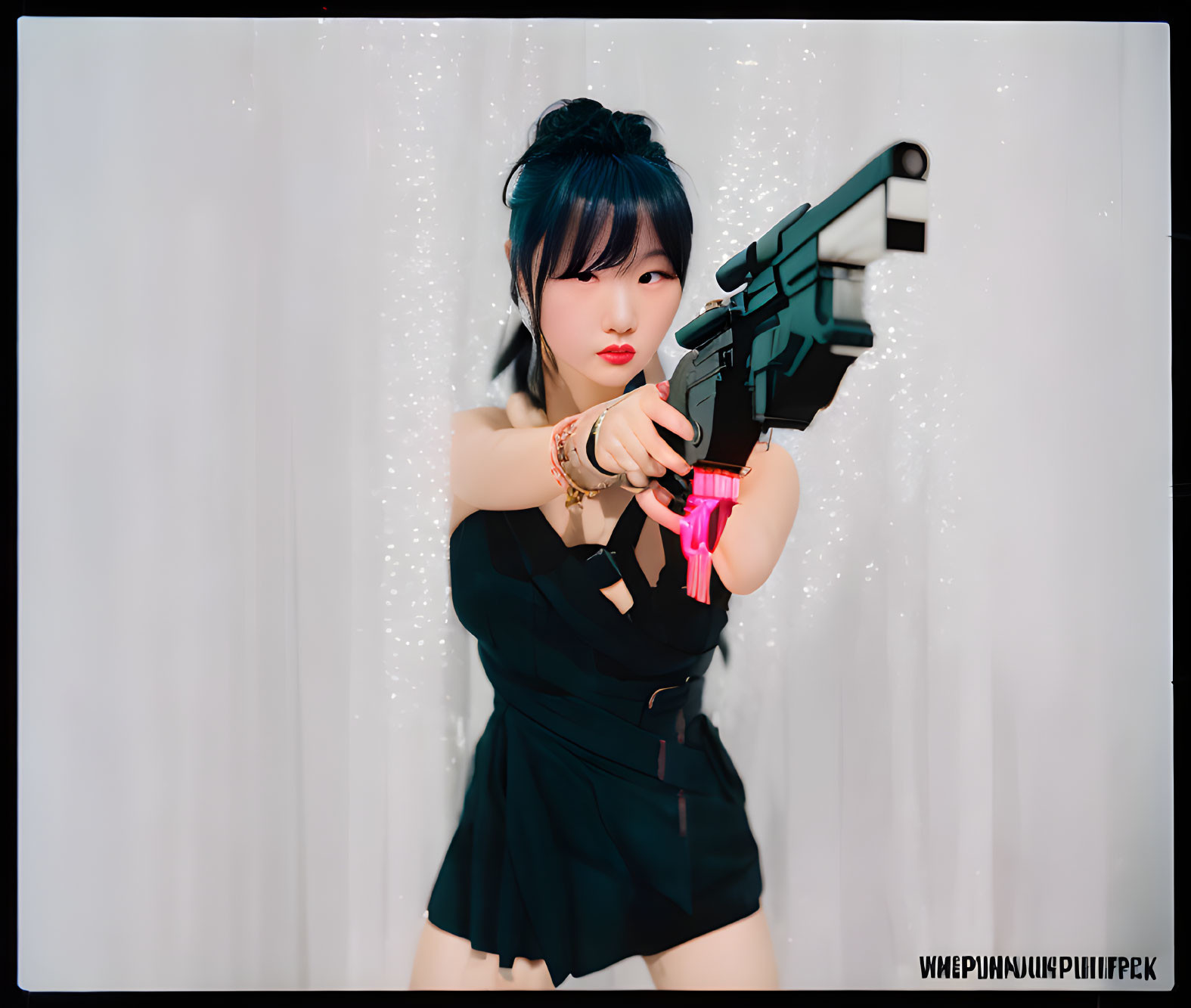 Dramatic pose with toy gun in black outfit against white curtains