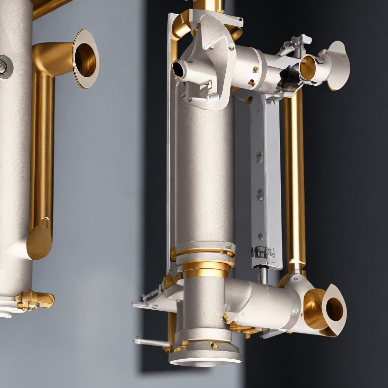 Modern wall-mounted plumbing with metallic pipes and brass fittings on grey background.