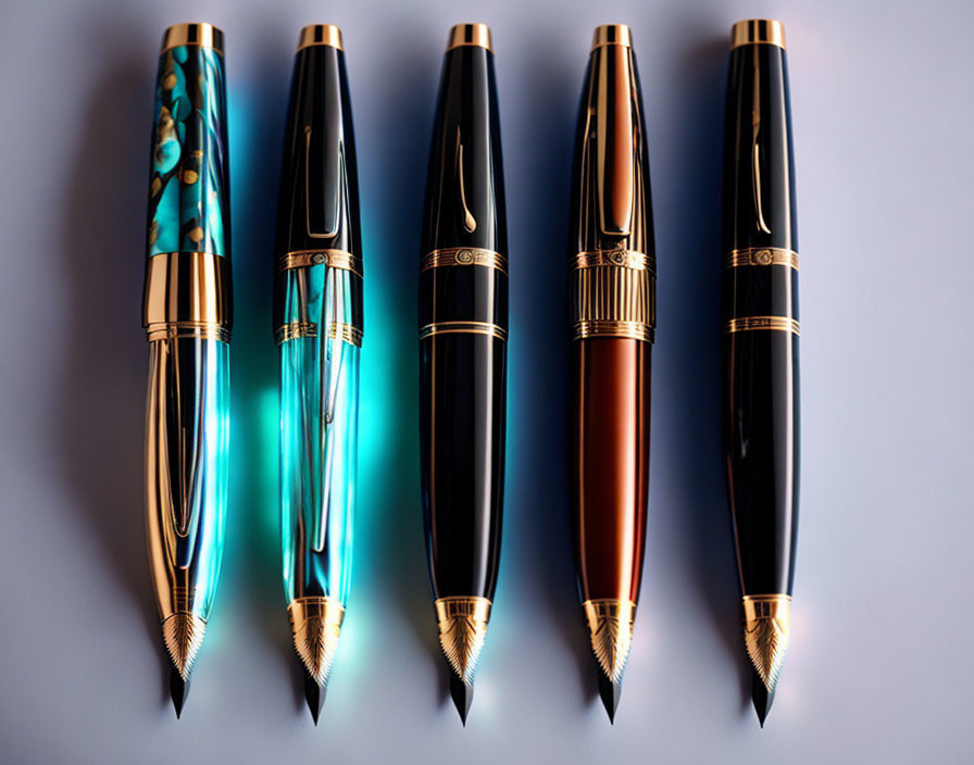 Assortment of Elegant Fountain Pens with Gold Accents and Nibs