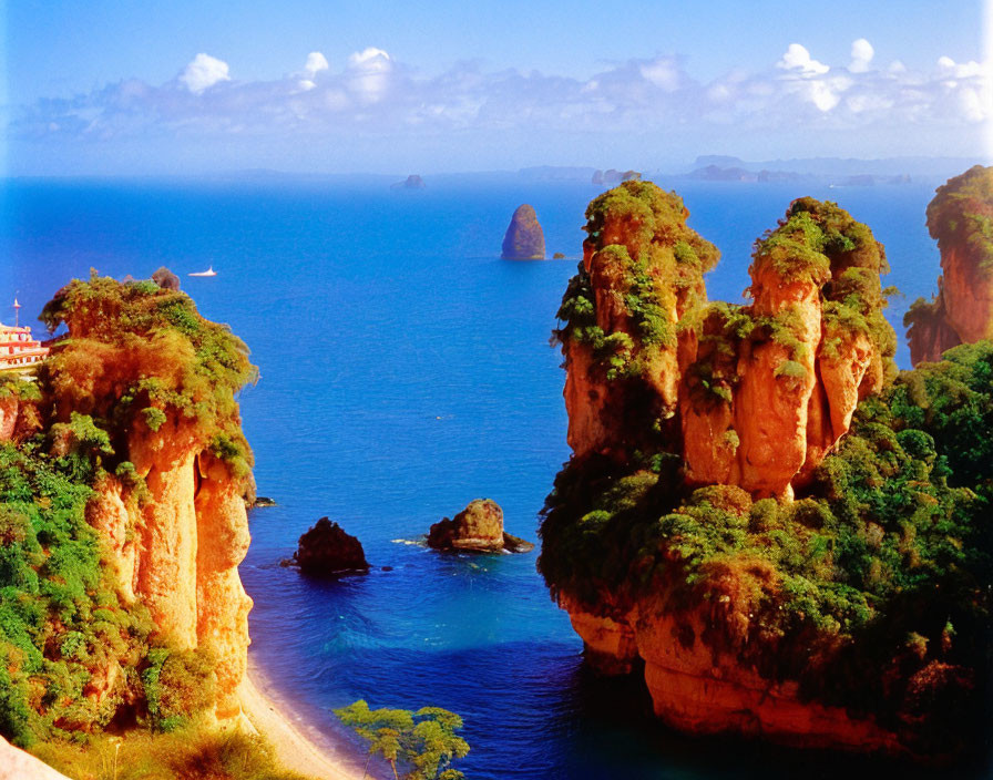 Coastal Area with Red Cliffs, Greenery, and Blue Sea