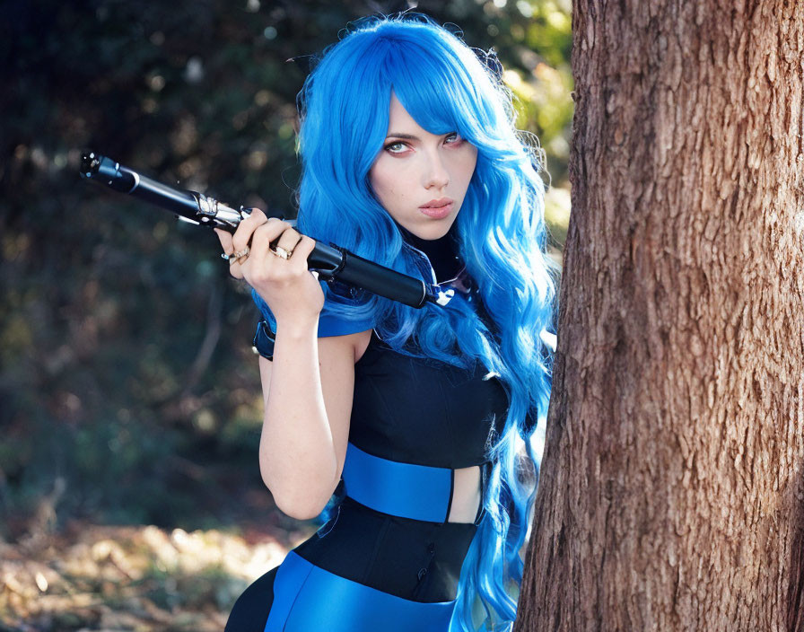 Blue-haired person in blue outfit poses with sniper rifle by tree