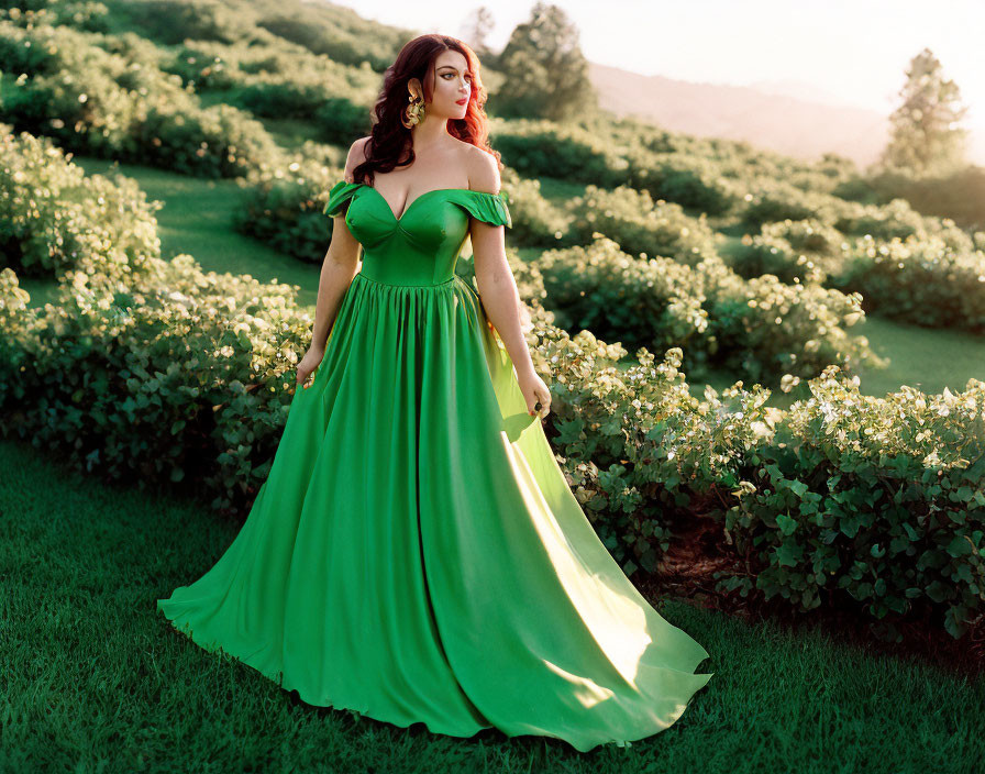 Elegant woman in green off-shoulder gown in lush garden