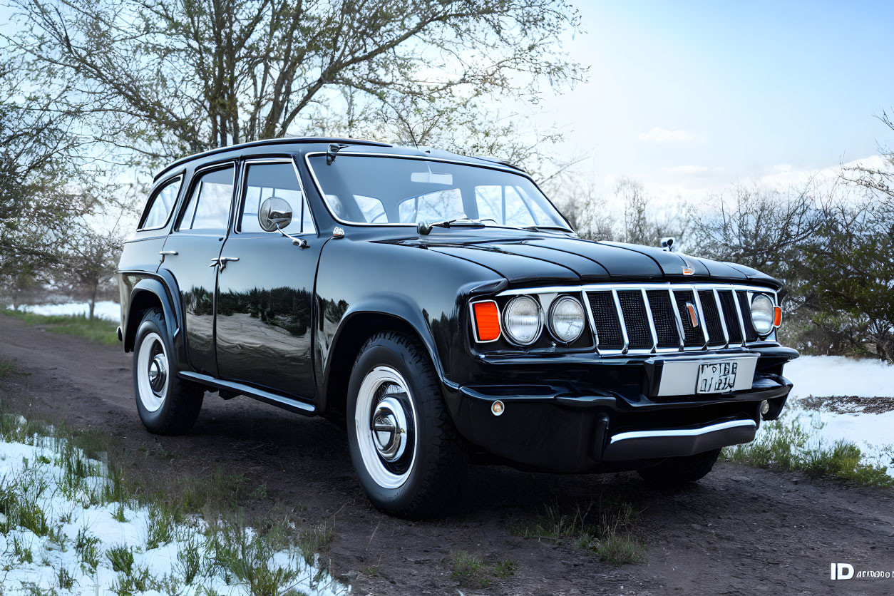 Vintage Black Station Wagon on Snowy Dirt Road