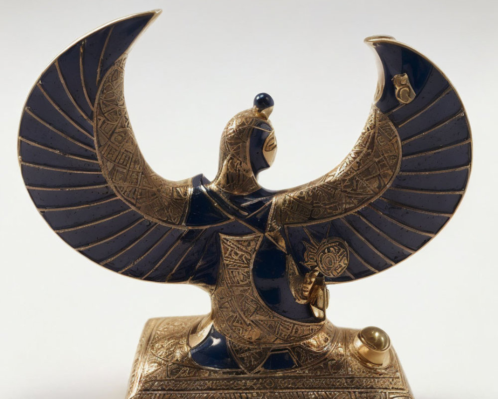 Intricate Golden Winged Creature Figurine on Rectangular Base