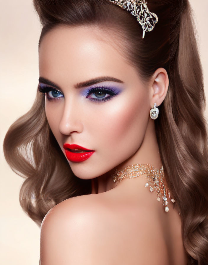 Glamorous woman with bold red lips and blue eyeshadow, wearing tiara and jewelry