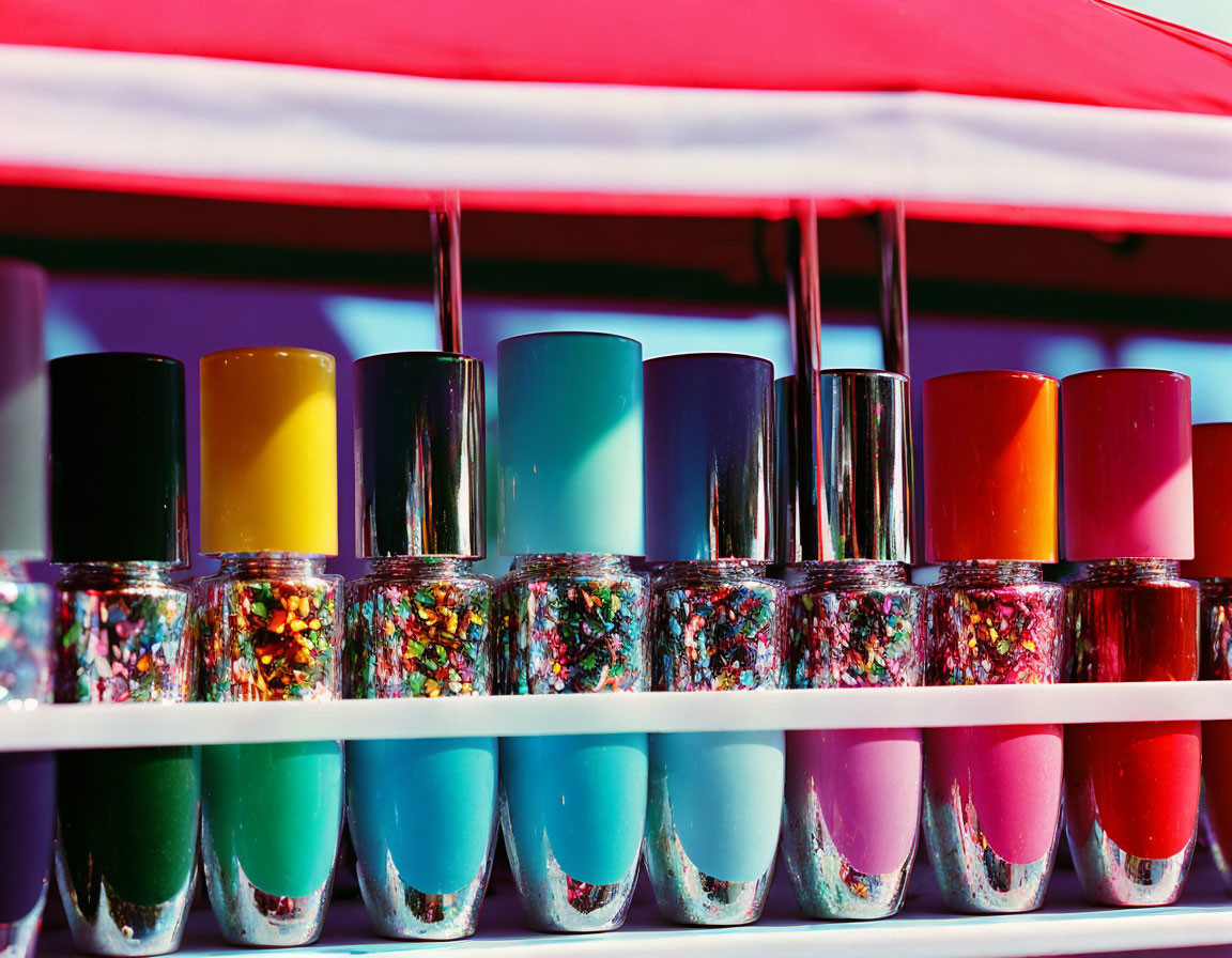 Colorful Nail Polish Bottles Displaying Various Hues Including Glitter