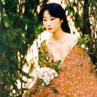 Serene woman in orange shawl among green willow branches