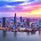 Modern Cityscape Aerial View at Dusk with Skyscrapers and Water Reflections