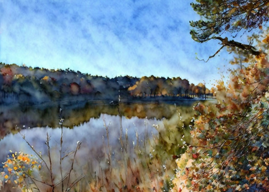 Tranquil lake with autumn forest and clear blue sky