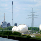 Modern cityscape with high-rise buildings, waterfront, and greenery.