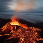 Majestic night volcano eruption with glowing lava flows