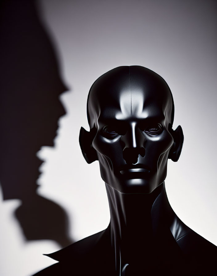 Shiny black mannequin head with bold facial features on light background