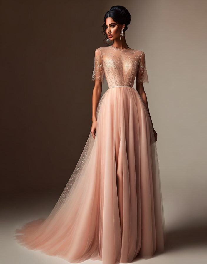 Elegant woman in peach evening gown with beadwork and sheer cape sleeves