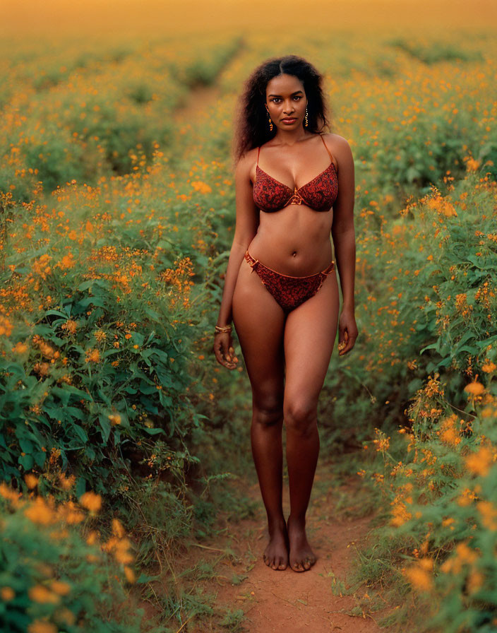 Woman in Red Bikini Standing in Field of Yellow Flowers