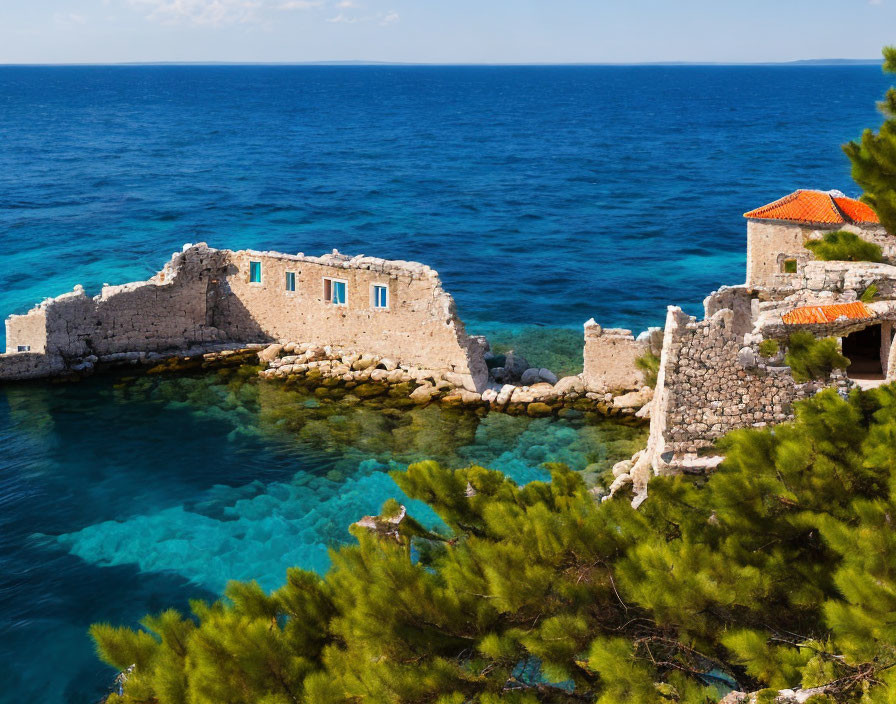 Ancient stone structure ruins with blue windows by turquoise sea