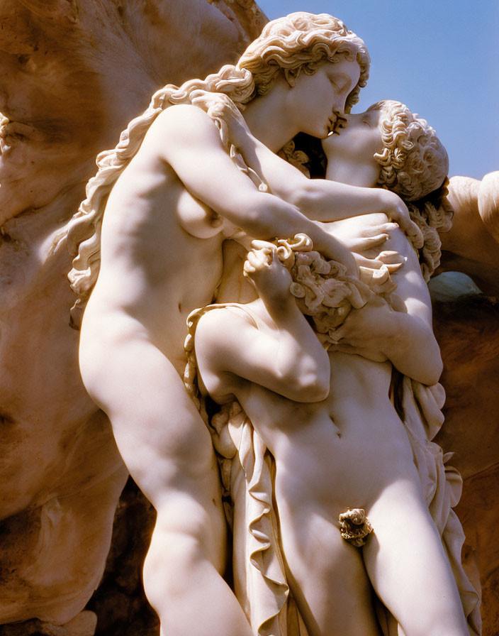 Classical sculpture of nude female embracing child with intricate details