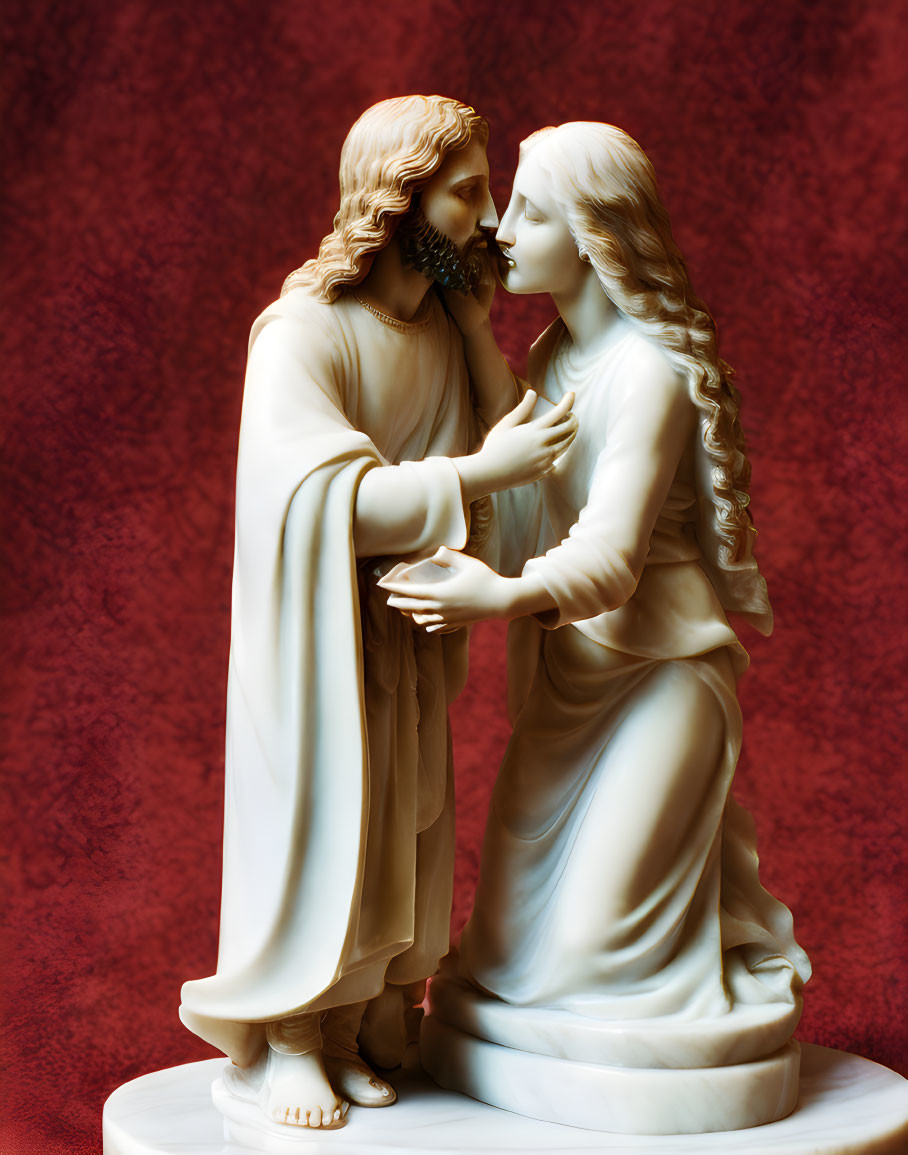 Detailed White Sculpture of Man and Woman in Intimate Pose on Red Backdrop