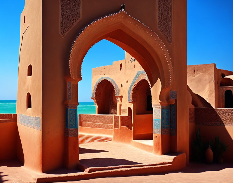 Traditional Arched Architecture with Ornate Designs in Warm Tones Against Blue Sky and Ocean