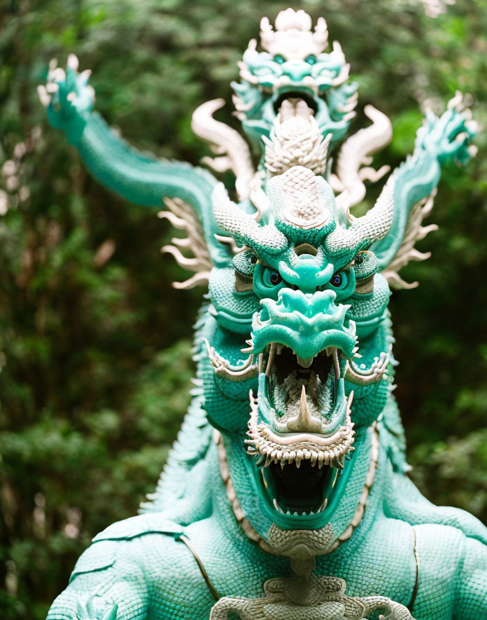 Turquoise Dragon Statue with Intricate Scales Roaring in Green Background