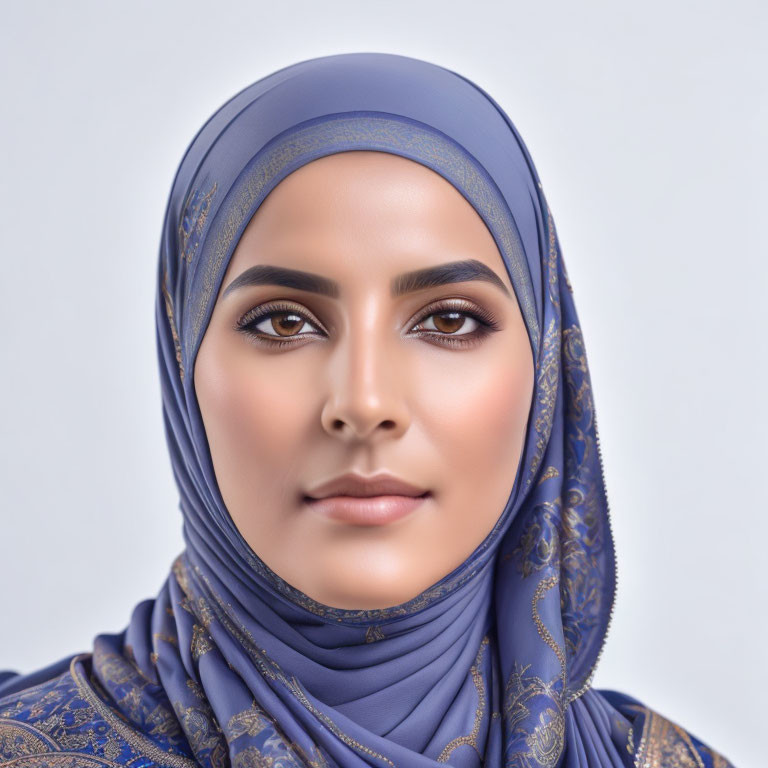 Woman in Blue Hijab with Gold Patterns and Groomed Eyebrows