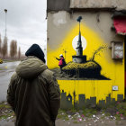 Hooded figure admiring vibrant street art mural and traditional building.