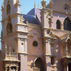 Pink Baroque Church with Decorative Spires and Statues