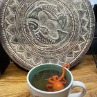 Giant Octopus in Misty Jungle with Steaming Clay Pot