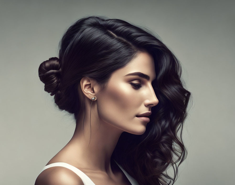 Woman with Dark Hair in Low Bun and Stud Earrings Wearing Bare Shoulder Top