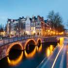 Amsterdam cityscape: canal, bridges, Dutch buildings, boats