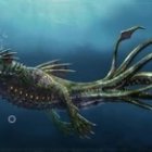 Green-Scaled Aquatic Dragon Submerged Underwater