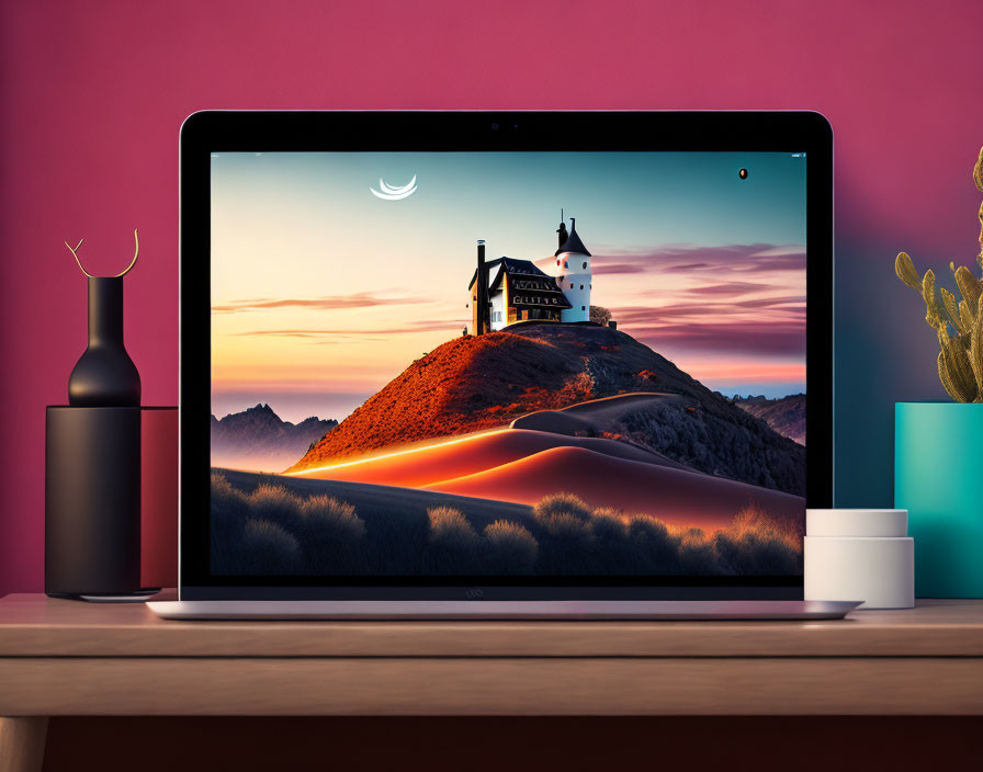 Laptop on Desk with Castle Wallpaper, Vase, and Cactus