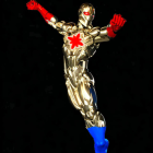 Gold and Red Armored Figure with Emblem on Chest Floating on Black Background